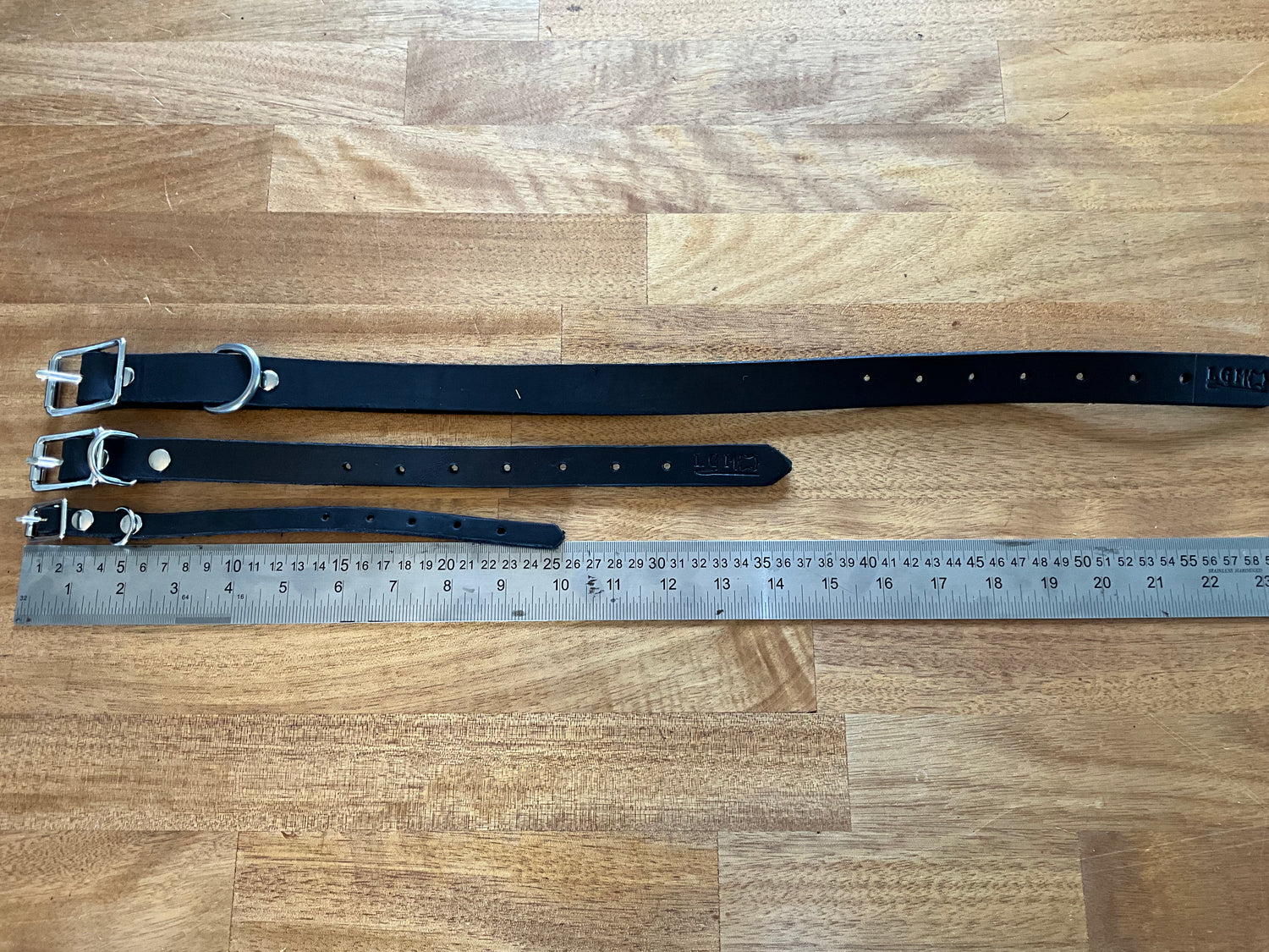 Dog collars in three sizes handmade in black leather by N’hay Gear
